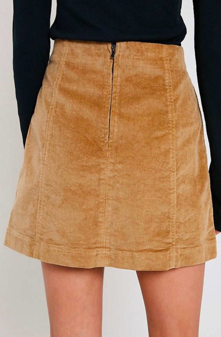 Corduroy is back in style! This mini skirt is perfect for this occasion, featuring a panel design and having a back zipper. Pair this skirt with a long sleeved top and some knee high boots for the perfect fall look. 98% cotton, 2% spandex Hand Wash Cold. imported S M L WAIST 28" 29" 30" HIP 36" 37" 38" LENGTH 16" 16.5" 17" Fitted Brown Corduroy Mini Skirt, Trendy Fall Mini Skirt With Zipper Closure, Trendy Mini Skirt With Zipper Closure For Fall, Cotton Mini Skirt For Fall, Fall Cotton Mini Skirt, Mini Length Bottoms With Side Zipper For Fall, Fall Mini Bottoms With Side Zipper, Chic Winter Cotton Mini Skirt, Fall Mini Lined Skirt