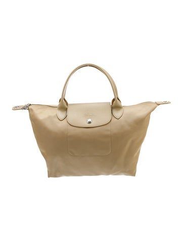 Longchamp Top Handle BagNeutrals NylonSilver-Tone HardwareLeather TrimFlat Handles & Single Adjustable Shoulder StrapLeather Trim EmbellishmentNylon Lining & Single Interior PocketZip Closure at Top & Snap Closure at Front Longchamp Bag Beige, Longchamp Backpack Beige, Longchamp Beige, Longchamp Le Pliage Pouch With Handle, Longchamp Pouch With Handle, Longchamp Expandable Travel Bag, Handbag Handles, Top Handle, Top Handle Bag