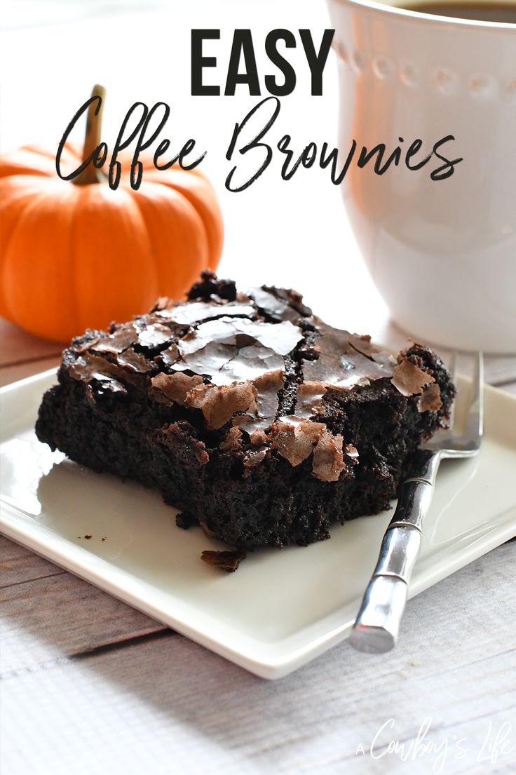 a white plate topped with brownies next to a cup of coffee and a pumpkin