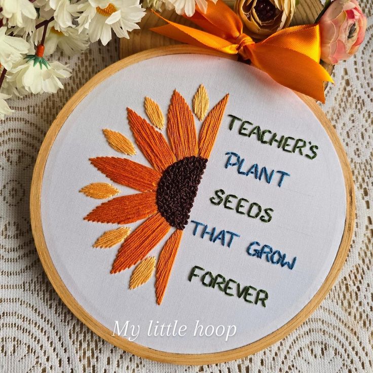 a cross stitch sunflower with the words teachers plant seeds that grow forever on it