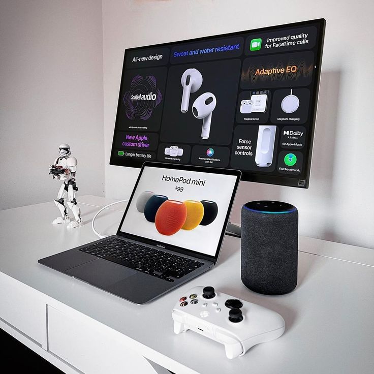 an open laptop computer sitting on top of a white desk