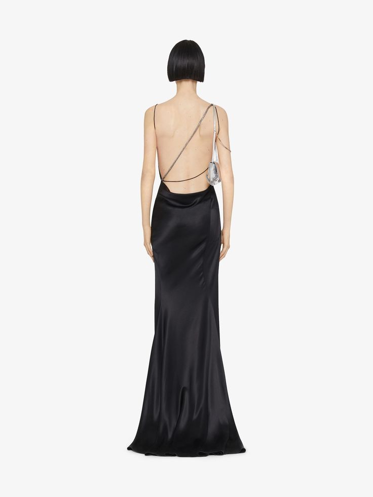 Long evening dress with satin. Open back with embroidered crystals asymmetric straps detail. Draped. Invisible zipped closure on the side. Slit on the front. Long flowing skirt. Model measures 5.8 Feet and wears a size 36. Long Flowing Skirts, Skirt Model, Givenchy Women, Long Evening Dress, Html Color, Cowboy Boots Women, Flowing Skirt, Draped Dress, Evening Dresses Long