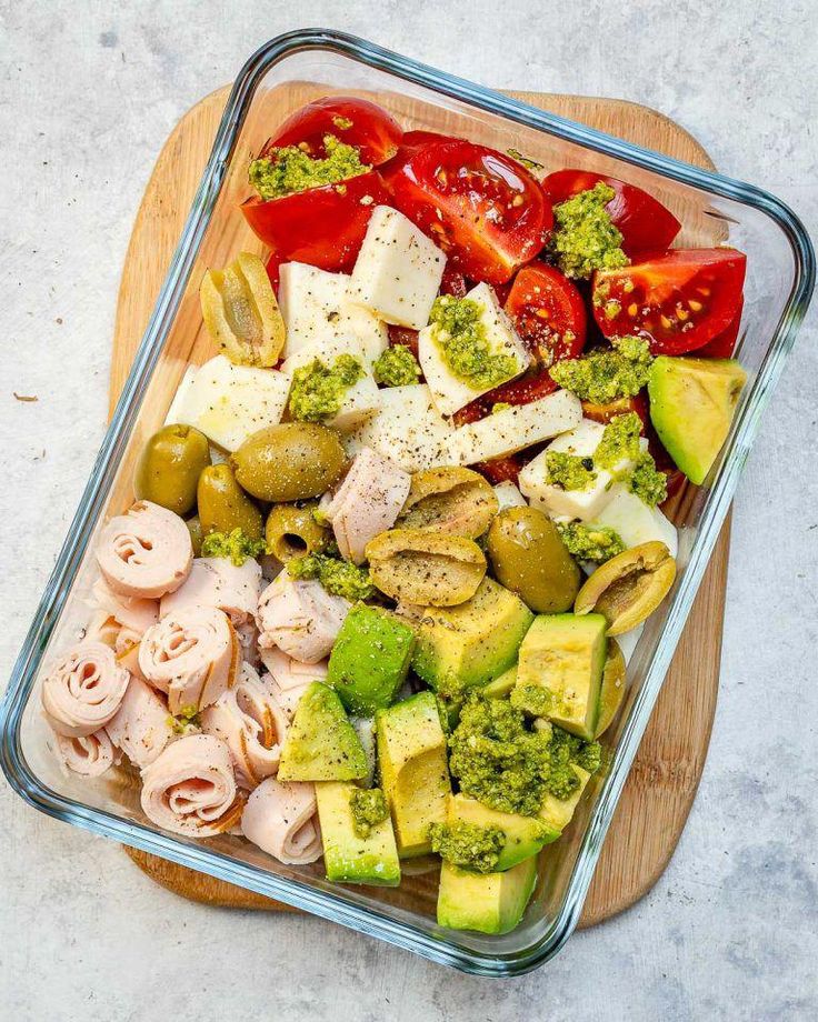 a glass dish filled with different types of food