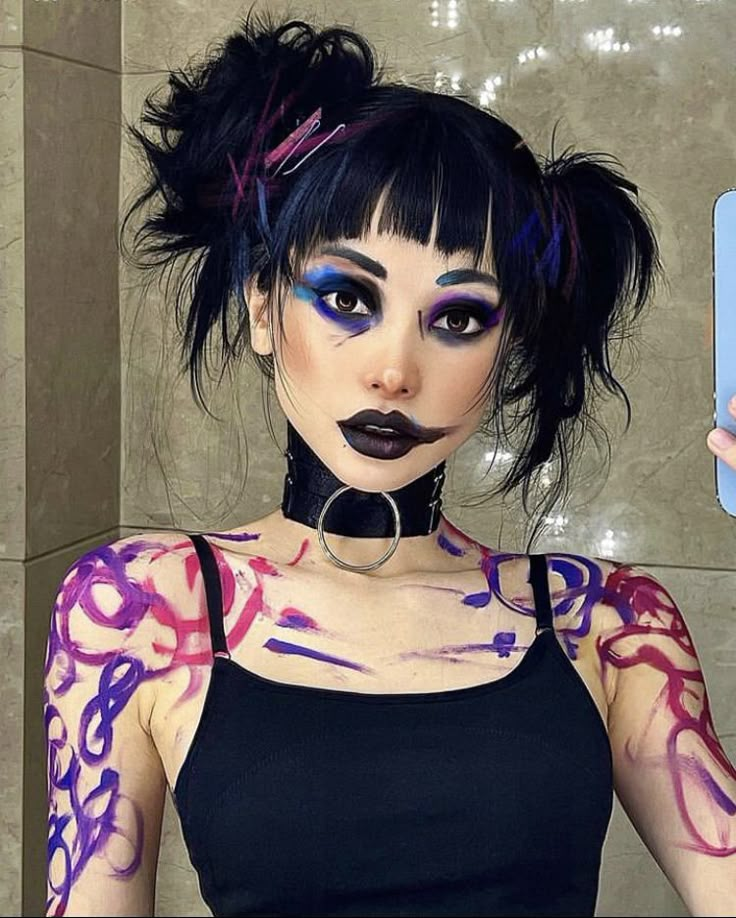 a woman with black hair and purple makeup is taking a selfie