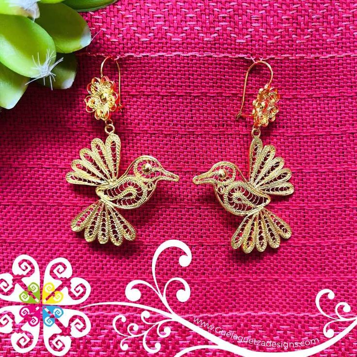 Beautiful and stunning handmade Mexican Filigree Earrings.  Each piece is meticulously created out of copper wire and spun into a beautiful design. To give it the final touch artisans dipped into gold plate for it's gold color.  This accessory is an important part of the traditional Tehuana outfit from Oaxaca, Mexico.  Look elegant while wearing Mexico's culture with this one of a kind earrings! Approximate length: 3.5 - 4 in Elegant Copper Wire Drop Earrings, Handmade Copper Wire Earrings For Gifts, Traditional Handmade Rose Gold Jewelry, Traditional Rose Gold Earrings For Gift, Artisan Earrings With Intricate Design For Gift, Artisan Gold Earrings With Intricate Design, Traditional Gold Wire Wrapped Jewelry, Festive Filigree Hoop Earrings Gift, Bohemian Rose Gold Earrings For Gift