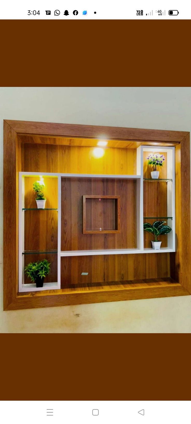 an empty room with wooden shelves and plants