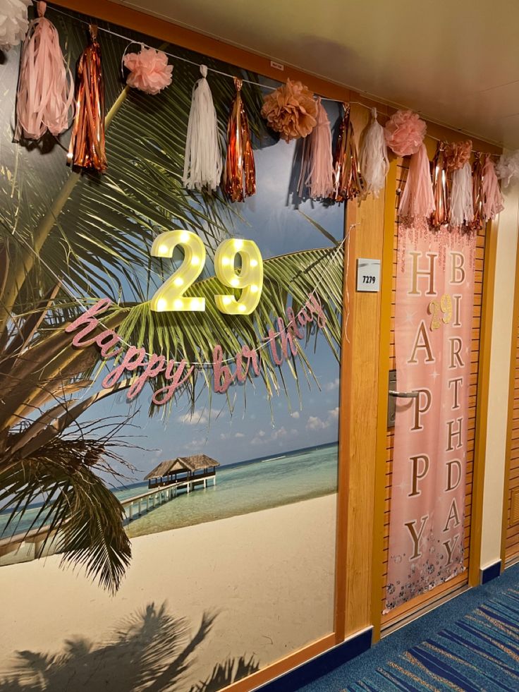 there is a sign that says 29 happy birthday hanging from the side of a door