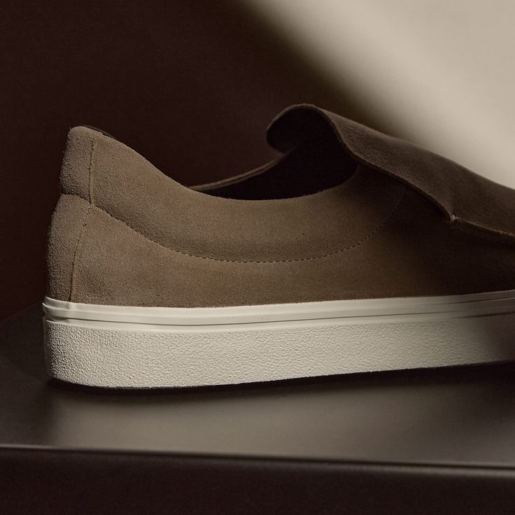 Our Coastal Suede Slip On is made with leather with vulcanized rubber outsole, adding flexibility and stability. Style detail includes leather lining. Additional Information:• 100% Leather • Leather lining, Removable Leather Insole • Imported Everyday Suede Slip-ons With Textured Sole, Modern Suede Slip-on Sneakers, Sporty Leather Slip-ons With Vulcanized Sole, Sporty Leather Slip-ons For Streetwear, Modern Suede Slip-on Sneakers With Rubber Sole, Suede Slip-on Sneakers With Leather Sole And Round Toe, Low-top Suede Slip-ons With Rubber Sole, Suede Low-top Slip-ons With Rubber Sole, Suede Slip-on Sneakers With Rubber Sole For Streetwear