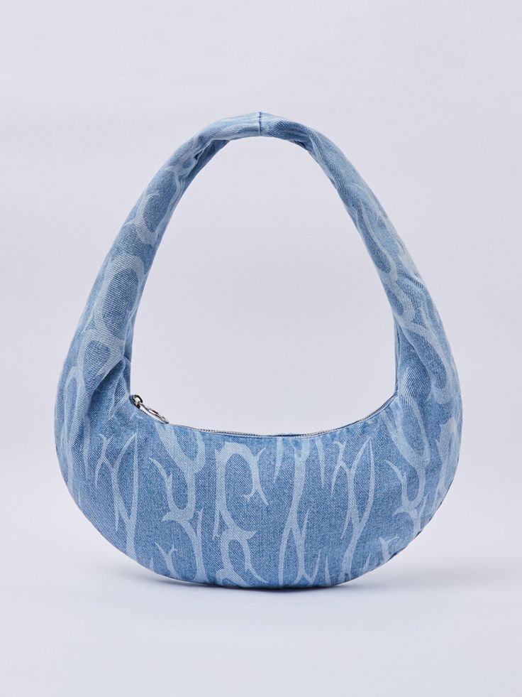 a blue bag with white designs on it