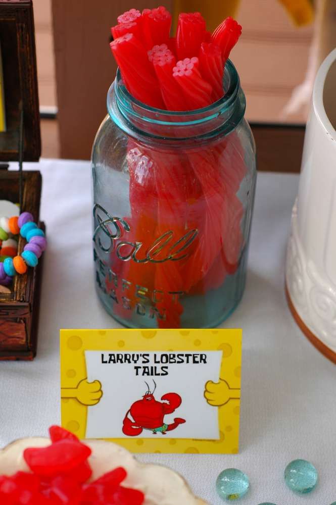 a jar filled with candy sitting on top of a table