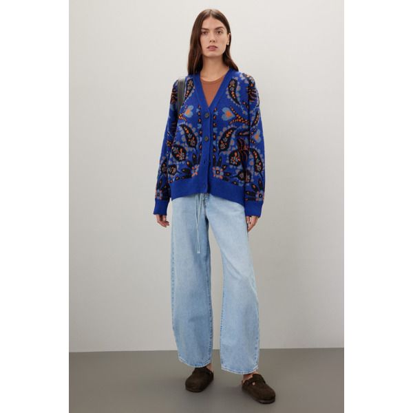 Blue abstract knit (55% Acrylic, 35% Polyamide, 10% Wool). Sweater. Long sleeves. V-neck. Front button closure. 25.5" from shoulder to hemline. Imported. Casual V-neck Jacquard Knit Cardigan, Spring Blue Jacquard Knit Cardigan, Casual Jacquard Knit Outerwear With V-neck, Blue Jacquard Knit Outerwear For Fall, Spring Casual Jacquard Knit Cardigan, Casual Jacquard Knit Spring Cardigan, Blue Relaxed Fit Cardigan For Fall, Blue Relaxed Fit Casual Cardigan, Blue Casual Relaxed Fit Cardigan