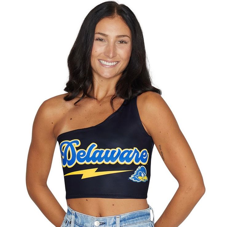 This super flattering University of Delaware Lightning One Shoulder Top is perfect for college game day paired with our Delaware Game Day Skirt for the cutest matching set! Our Delaware One Shoulder Top's stretchy fabric makes it the perfect option for all body types. You'll never want to take this adorable one shoulder top off! In stock & ready to ship in 1-2 business days. One size fits most. 88% Micropoly, 12% Spandex. Stretchy & soft fabric designed for all day use & long lasting quality. Su Collegiate Sleeveless Fitted Top, Collegiate Fitted Sleeveless Top, Fitted Athleisure Tops For College, Blue Fitted Top For Game Day, Fitted Sleeveless Top For Game Day, Team Spirit Stretch Tops For Sports Events, Fitted Sleeveless Team Spirit Tops, Spring School Spirit Stretch Tops, Fitted Sleeveless Top For Team Spirit