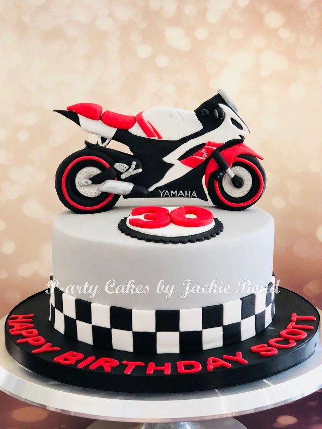 a birthday cake with a motorcycle on top