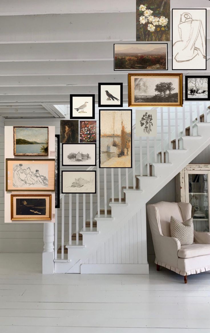 a staircase with many framed pictures on the wall and a chair in front of it