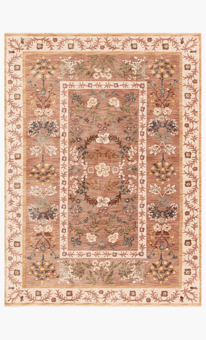 an area rug with various colors and designs on the border, including flowers and leaves