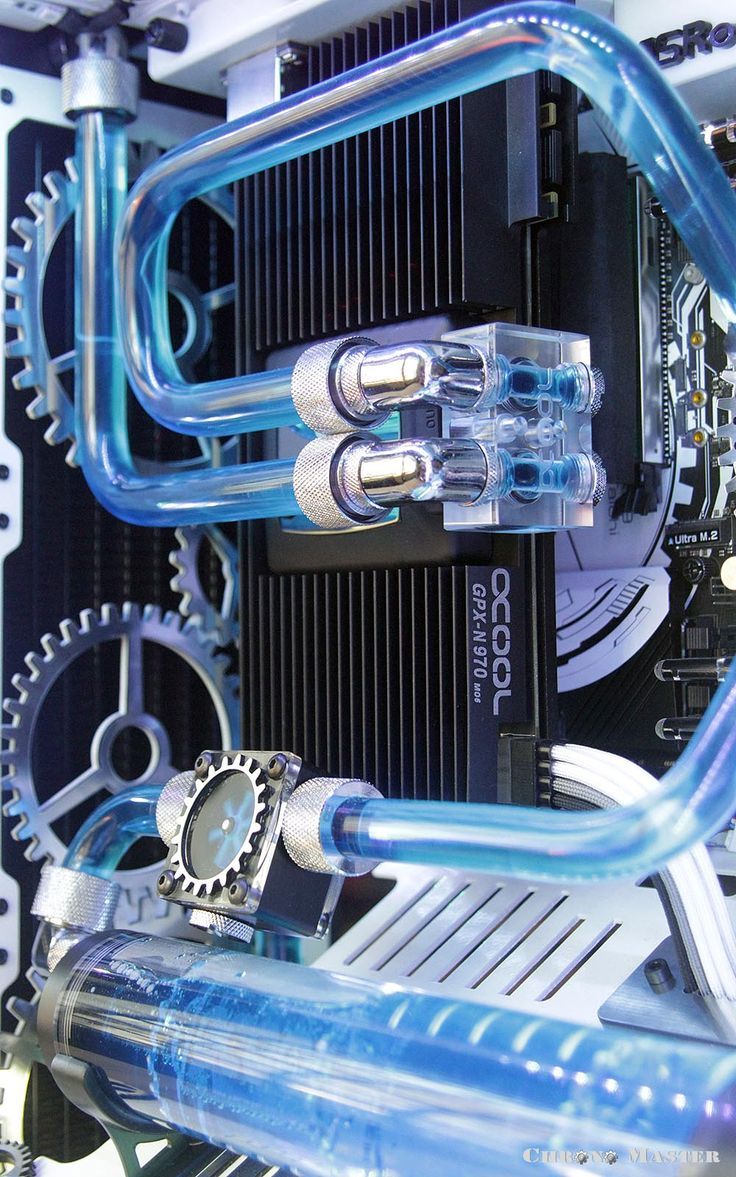 the inside of a computer case with blue pipes