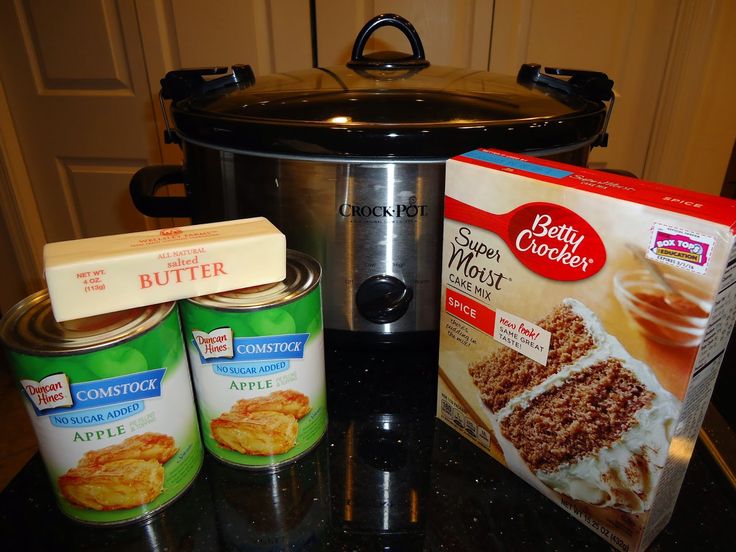 the ingredients needed to make an easy crock pot cake are displayed in front of the slow cooker