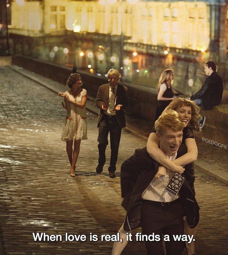 two people hugging each other in the middle of a city street with text that reads, when love is real, it finds a way