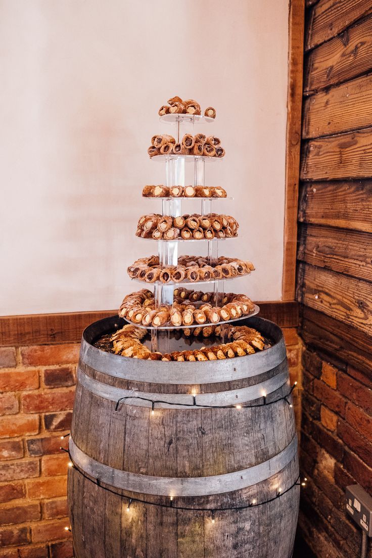 a wooden barrel filled with lots of pastries