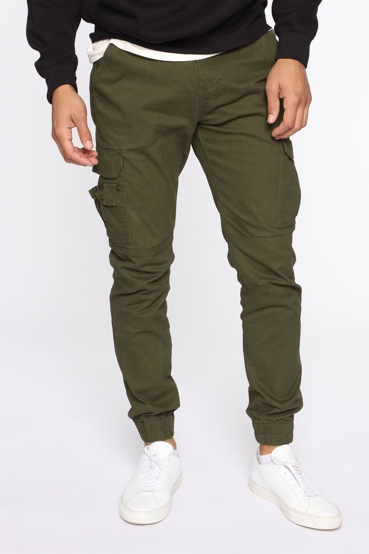 Available In Black, Khaki, Olive, And Camouflage Button Closure Zip Fly Cargo Pants Elastic Hem 31 Inseam 98% Cotton 2% Spandex Imported | Mens Kryptonite Cargo Pants in Olive Green size 32 by Fashion Nova Green Cargo Pants Outfit Street Style, Green Cargo Pants Outfit, Celana Kargo, Olive Green Cargo Pants, Celana Fashion, Cargo Pants Outfit, Green Cargo Pants, Streetwear Shop, Green Cargo