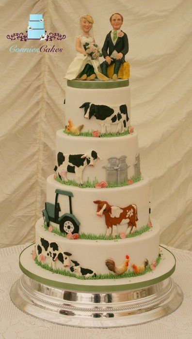 a wedding cake with farm animals on it