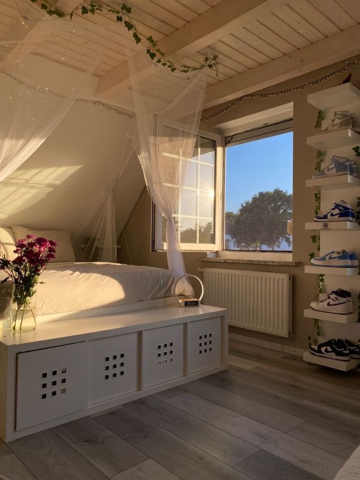 a bedroom with a white bed covered in mosquito netting