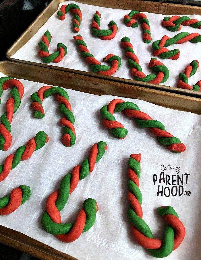 two trays filled with cookies shaped like letters