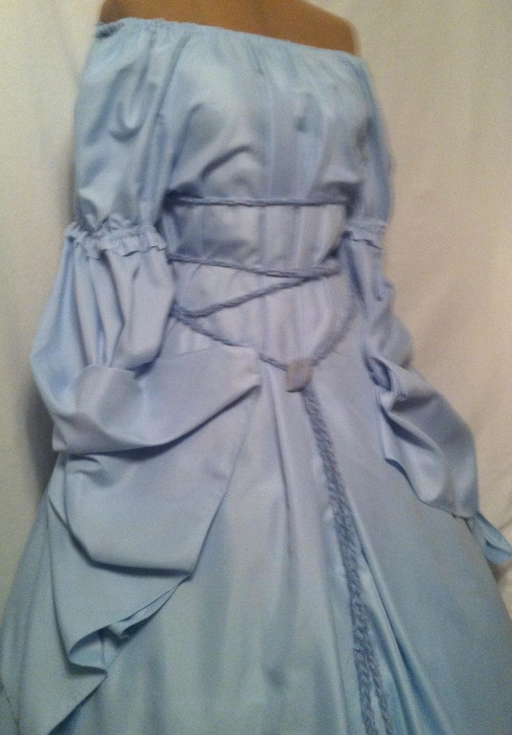 New fantasy Renaissance style of a beautiful Baby Blue gown with a noble puff sleeve and dagget Druid era  longer sleeve. The dress will fit a variety of sizes as belt ties around to fit any size body '  the dress has a Wrap around belt and a brooch to match the dress, Want to change color of belt, Let me know.  Please send me your height, dress size and the inches around your upper arm in order to ensure that your chemise fits as it should when you order the dress. I always get the dresses made Elegant Blue Medieval Dress, Elegant Fitted Blue Medieval Dress, Blue Victorian Dress With Historical Design, Historical Design Fitted Long Sleeve Dress, Victorian Fitted Dress For Fancy Dress, Victorian Style Fitted Dress For Fancy Dress Occasions, Fitted Vintage Dress With Historical Design For Costume, Fitted Blue Victorian Vintage Dress, Medieval Long Sleeve Fancy Dress