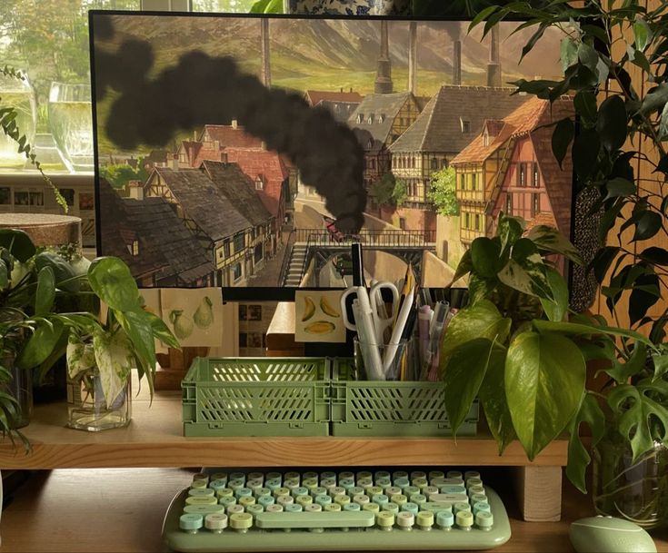 a computer keyboard sitting on top of a wooden desk next to a potted plant