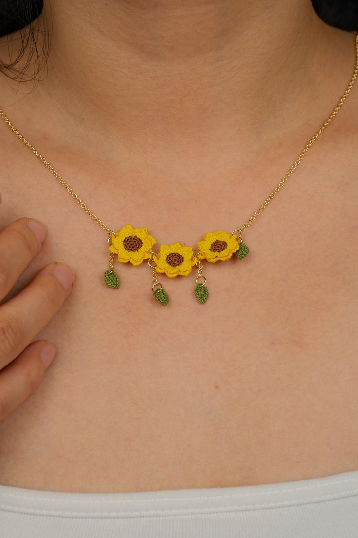 My name is Ling, and I am a craftsman living in Toronto. I am honored to present to you this uniquely designed micro crochet product. Each piece is handmade by me and can be customized. This special item makes a perfect gift for yourself or your loved ones. ---------------------------- F E A T U R E S ✨ The unique 3 sunflower pendant design ---------------------------- M A T E R I A L ✨ Micro crochet pendant ✨ 14K gold plated copper chain ---------------------------- N O T I C E ✨This is a finis Handmade Charming Dangle Jewelry, Charming Handmade Dangle Jewelry, Yellow Dangle Necklaces As Gifts, Cute Handmade Yellow Jewelry, Handmade Charming Gold Jewelry, Delicate Handmade Yellow Gold Charm Necklace, Gold Sunflower Dangle Jewelry, Handmade Yellow Gold Flower Necklaces, Yellow Flower Shaped Jewelry With Adjustable Chain