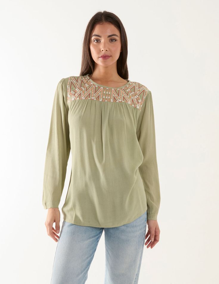 This delicate embroidery blouse brings a touch of elegance to your everyday wardrobe - Team this with light denim, and your all time favourite sandals. 100% ViscoseMachine washableRound necklineLong sleeveButton back fasteningMade in IndiaModel wears a size: SModel height: 5ft 7.5 / 170 cm Feminine Long Sleeve Embroidered Tops, Casual Embroidered Rayon Blouse, Spring Embroidered Rayon Blouse, Casual Long Sleeve Embroidered Blouse, Casual Spring Blouse With Embroidered Neckline, Relaxed Fit Long Sleeve Blouse With Embroidered Hem, Long Sleeve Blouse With Embroidered Hem Relaxed Fit, Long Sleeve Rayon Tops With Floral Embroidery, Long Sleeve Rayon Top With Floral Embroidery