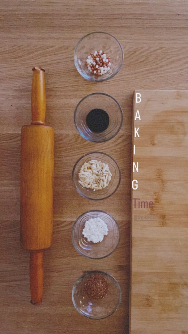 three bowls with different types of food in them next to a wooden cutting board and knife