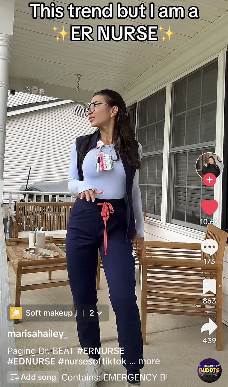 a woman standing on the porch in front of a house with an emergency sign above her head