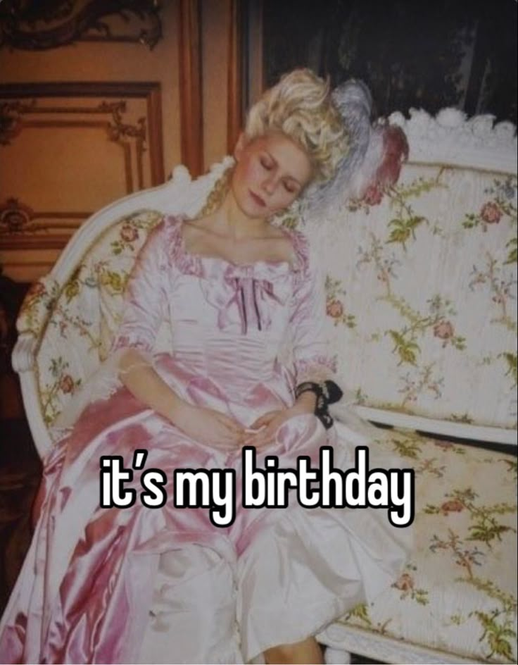 a woman in a pink dress sitting on a couch with the words it's my birthday