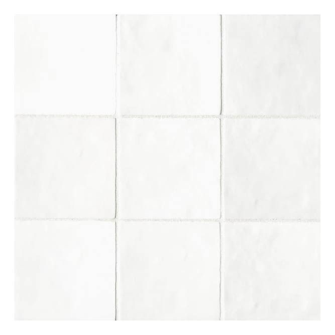 a white tile wall with squares in it