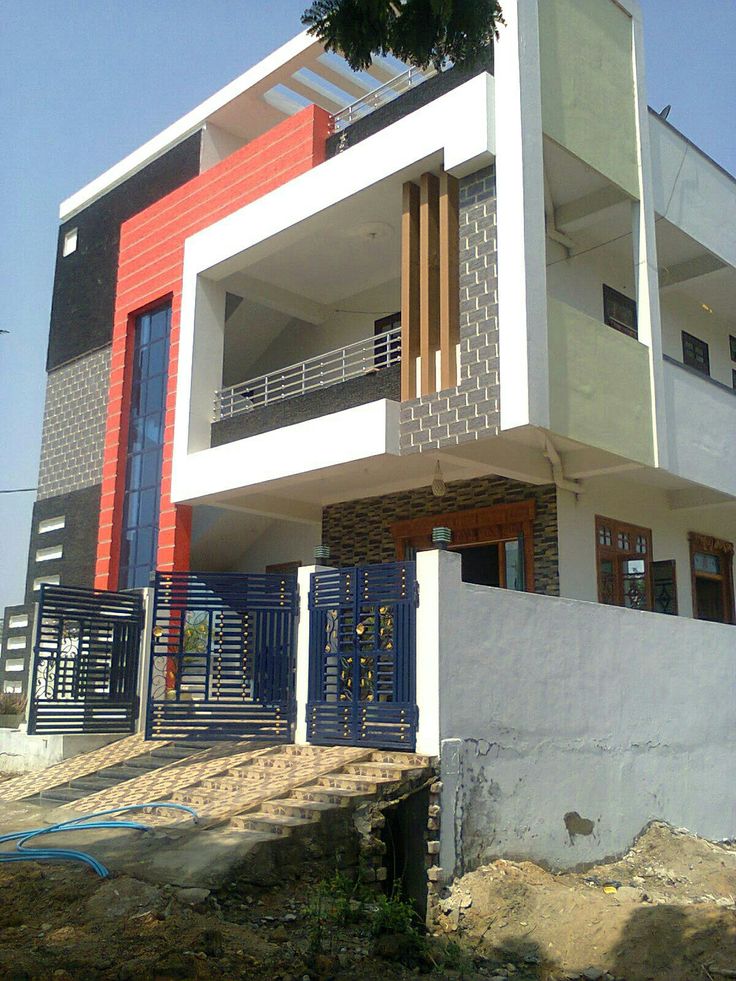 a white and red building with blue doors