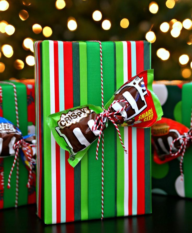 three wrapped presents sitting on top of a table