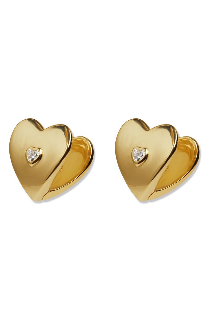 Accessorize in style with these sterling silver earrings featured in a sweet heart shape centered by a cubic zirconia and plated in gleaming 18-karat gold. 1/2" drop Omega-clip closure Sterling silver/18k-gold plate/cubic zirconia Imported Elegant Huggie Earrings For Valentine's Day, Elegant Double Heart Huggie Earrings With Heart Charm, Elegant Heart-shaped Yellow Gold Huggie Earrings, Elegant Heart-shaped Huggie Earrings, Elegant Huggie Heart Earrings, Elegant Gold Plated Heart Huggie Earrings, Elegant Yellow Gold Huggie Earrings For Valentine's Day, Gold Classic Diamond Earrings For Valentine's Day, Elegant Gold Plated Huggie Earrings For Valentine's Day