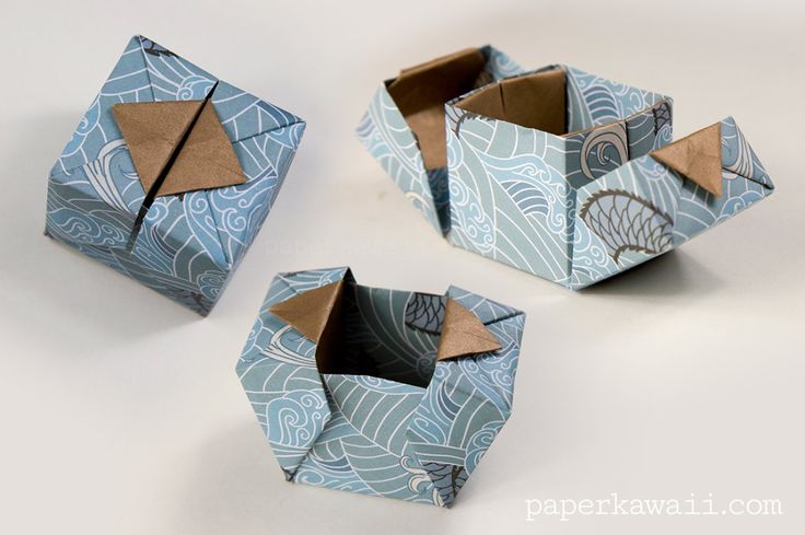 three origami boxes sitting on top of each other