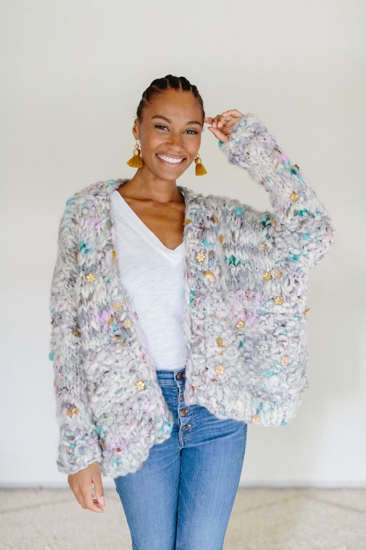 Welcome to the Dreamland Cardi Kit. Originally released as part of our Fall 2020 Knitalong, this beautiful yet classic design showcases our Dreamland yarn so wonderfully. This unique yarn is inspired by the insanely amazing trim markets of India and is jam packed with gorgeous ribbons, flower appliques and novelty trims. Along with the yarn, you'll receive the PDF pattern via email as well. About the pattern: A perfect sweater for any occasion, the Dreamland cardi is a piece of wearable art that Knit Sweater Pattern Beginner, Knit Sweater Pattern, Simple Cardigan, Front Pieces, Plaid Party, Button Shawl, Knit Collage, Beginner Knitting Pattern, Unique Yarn