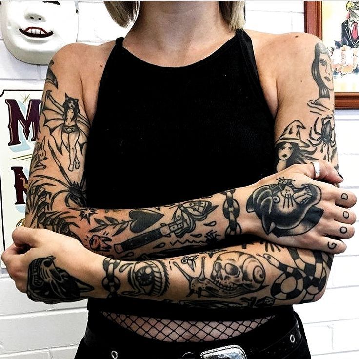 a woman with tattoos on her arm and arms