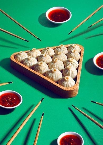 there are many small dumplings on the green table