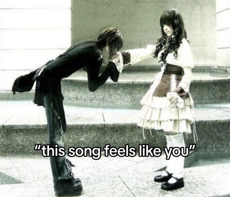 two people standing next to each other on steps with the caption'this song feels like you '