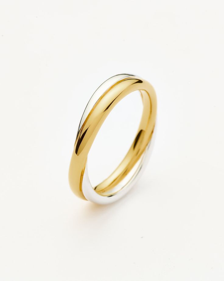 two tone gold and white wedding ring on a white background with copy space for text