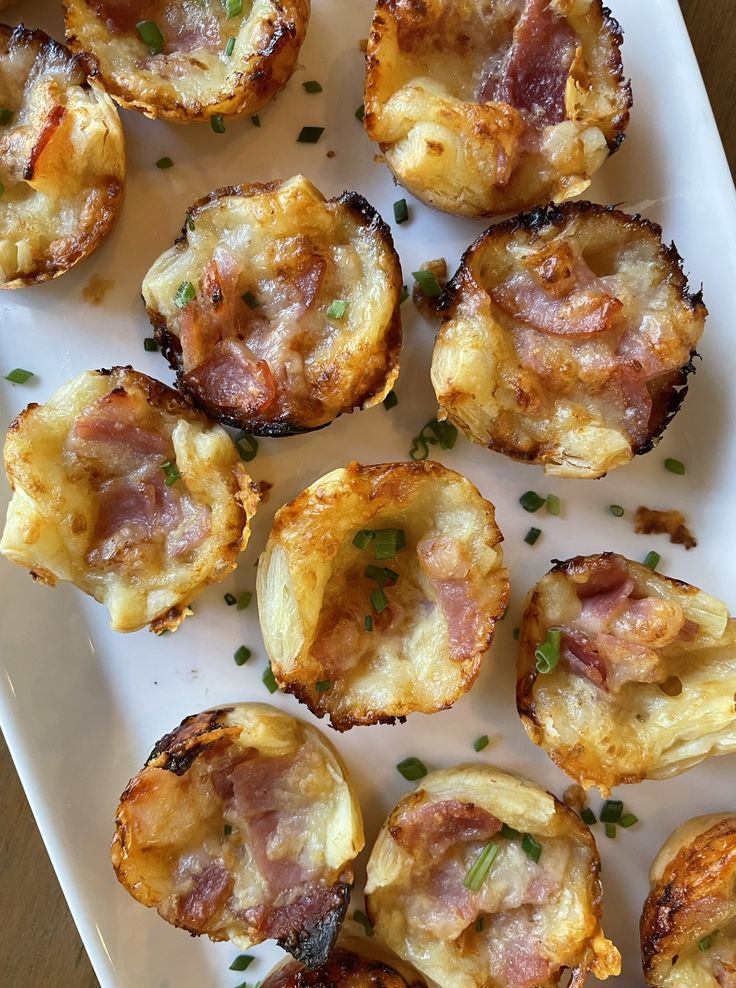 small appetizers are arranged on a white plate