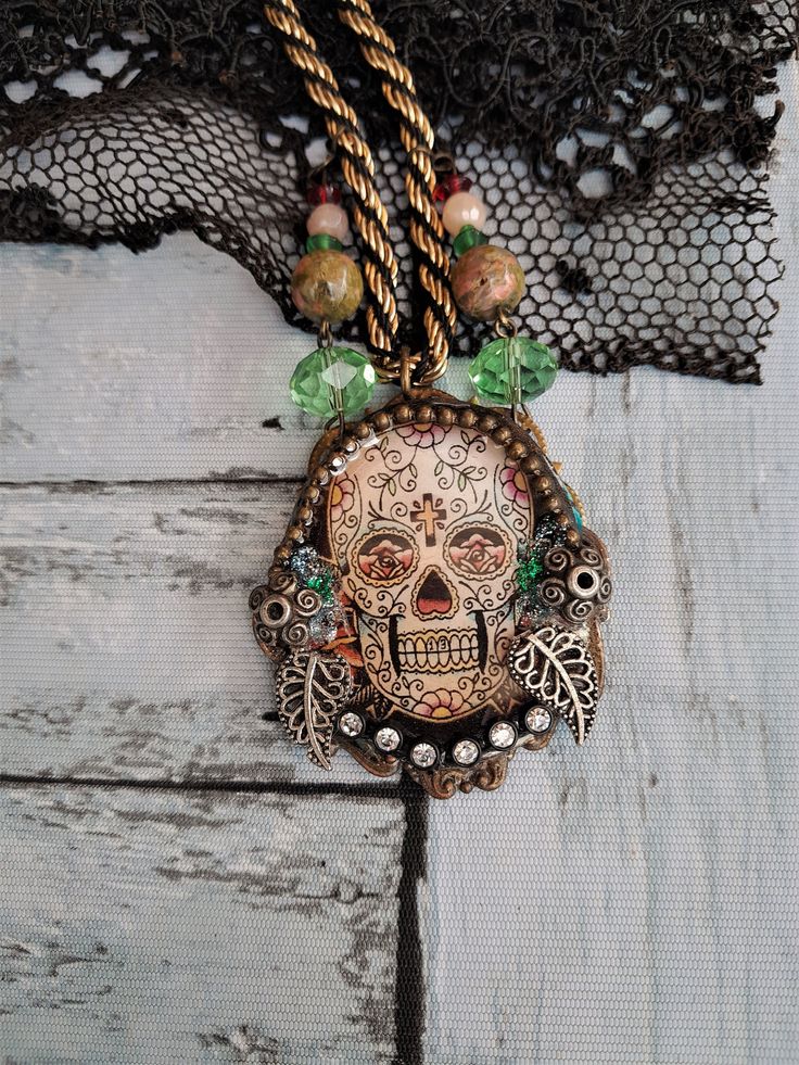 "All my creations, even the smallest are made in a single copy (unique piece)   Gothic Skull Pendant\" UNAKITE beads and genuine cut crystals. The cabochon is made of \"crystal\" resin with metal inclusions and small white glass crystals. Gothic Pendant Necklace sold with its gold and black braided metal chain. - size height 5 cm /1.77\"x Wide 4.8 cm/  1.57\"  Nice gift idea. Mid-length neck circumference = 28 cm/11.02\"" Handmade Gothic Skull Necklace, Halloween Skull-shaped Jewelry For Jewelry Making, Halloween Skull Jewelry For Jewelry Making, Halloween Skull-shaped Jewelry Making Supplies, Halloween Jewelry Making Skull Beads, Vintage Skull Necklace For Gift, Vintage Skull Shaped Necklace For Gift, Nickel-free Skull Jewelry For Day Of The Dead, Nickel Free Skull Jewelry For Day Of The Dead