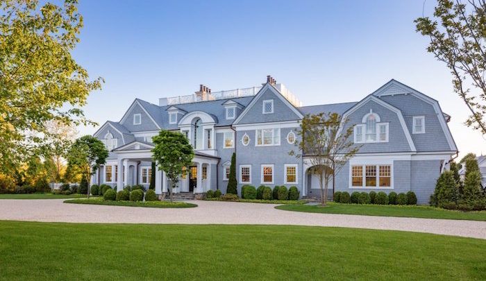 a large blue house with lots of windows