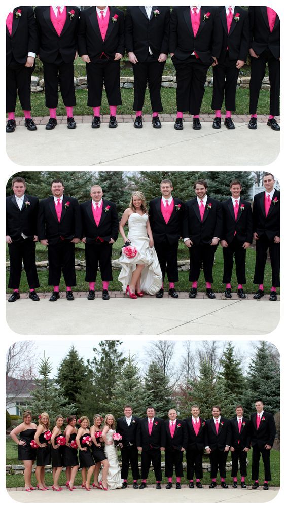 a group of people in black suits and pink ties posing for pictures with each other