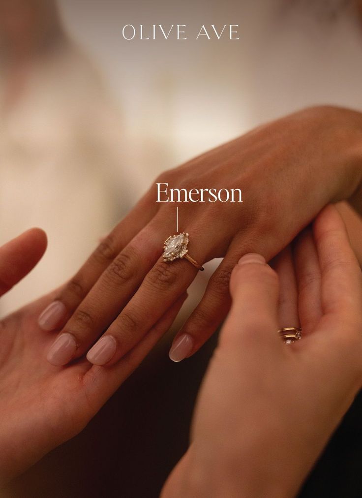 two people holding each other's hands with the words emerson written below them on their fingers