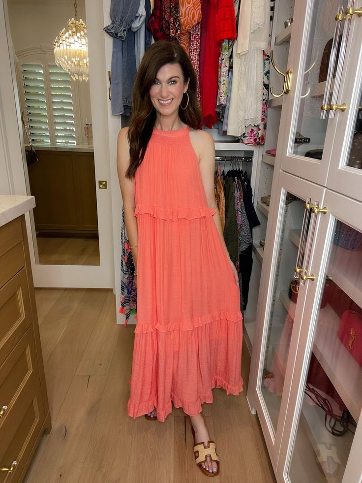 Get ready to dream of summer in our Summer Dream Maxi Dress! Made with lightweight, airy fabric, this gorgeous coral dress has that effortless feel and features a tiered body with ruffle trim. Add a slicked back ponytail or bun and pair with sandals or wedges for the perfect summer look. Carefree, chic, and easy - it's the perfect summer dress! This if fully lined. Strap length can be adjusted in the back. Dress measures 53" in length. Bust measures 22" from underarm seam to seam. Measurements taken on a small. Fabric has some give. This has a generous fit. Your normal size will be roomy throughout. If in between sizes or wanting a less loose fit, size down. Be sure to watch the fit video on the app for more information. FABRIC: 100% poly Heather is a 4 and 5'6" wearing a small. Back Ponytail, Fit Video, Slicked Back Ponytail, Deodorant Stains, Coral Dress, Scarf Hat, Summer Dream, Summer Look, Hat Hairstyles